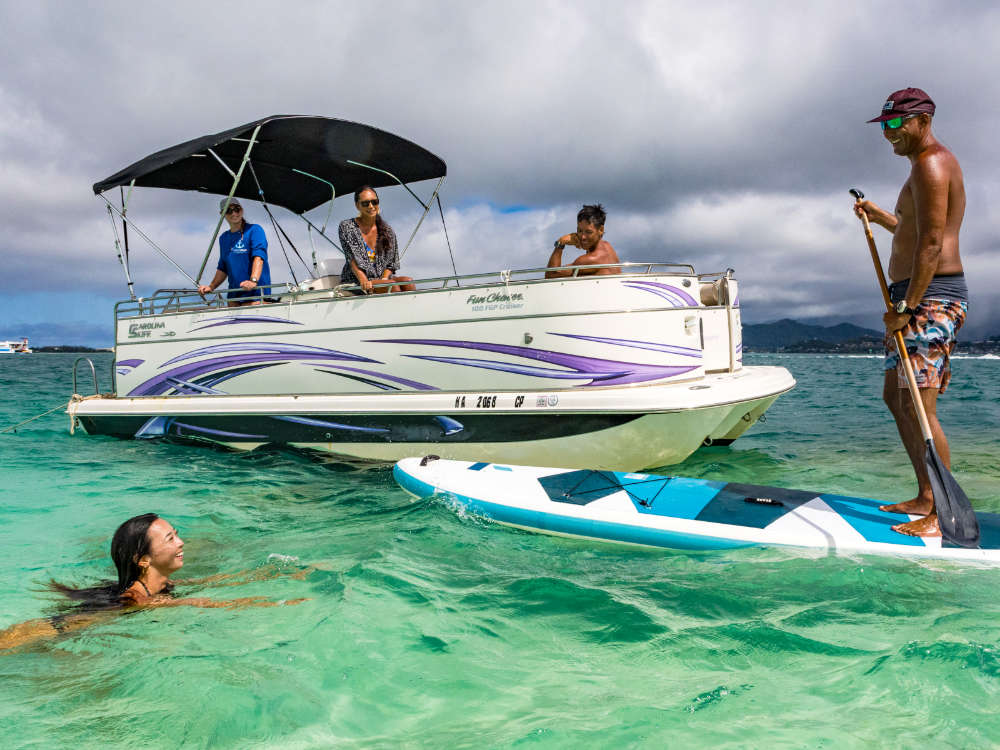 Pontoon Boat – A serene escape with snorkeling, paddleboarding, and sandbar relaxation.